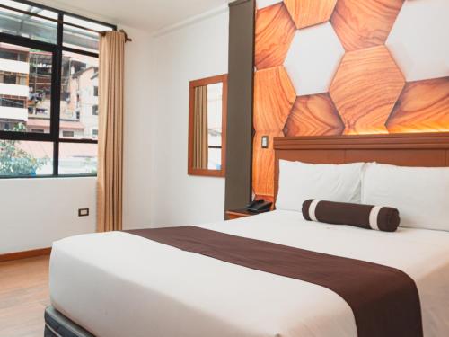 Postel nebo postele na pokoji v ubytování Hotel Ferré Machu Picchu