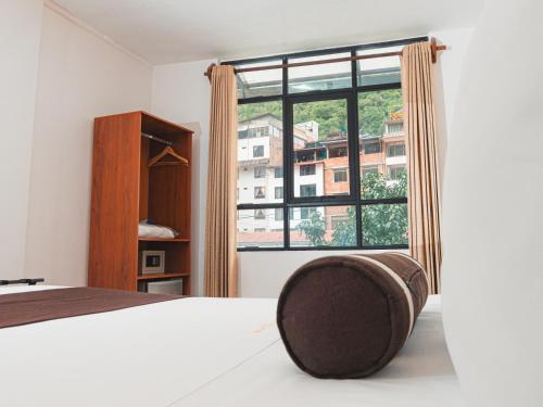 Postel nebo postele na pokoji v ubytování Hotel Ferré Machu Picchu