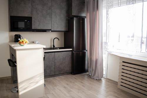 Η κουζίνα ή μικρή κουζίνα στο MyPlace Gray Apartment Sandomierz