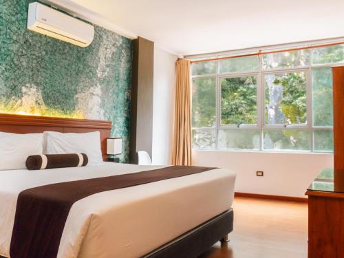 Postel nebo postele na pokoji v ubytování Hotel Ferré Machu Picchu