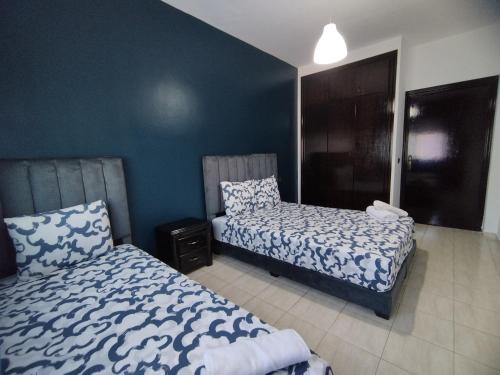 Postel nebo postele na pokoji v ubytování rabatcitycenterresidence