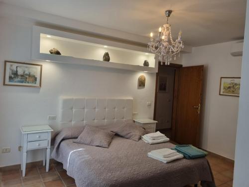 Postel nebo postele na pokoji v ubytování Elba-bella casa in Campagna, meraviglioso giardino, animali ammessi