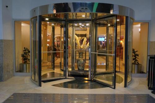 a display case in a building with vases in it at The Green Park Bostancı in Istanbul