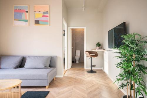 a living room with a couch and a table at 3F - In the heart of Trondheim in Trondheim