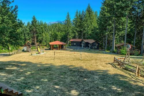 a large yard with a playground and a house at M-Hill Lodge Stevenson 98 in Stevenson