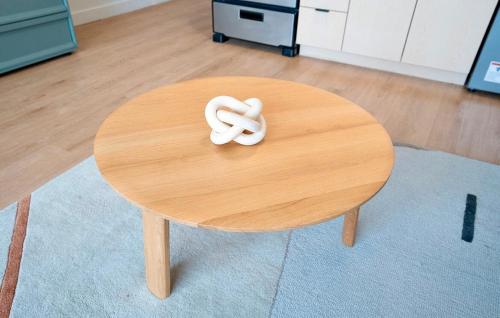 a wooden table with a white symbol on it at Salt City Retreat in Salt Lake City