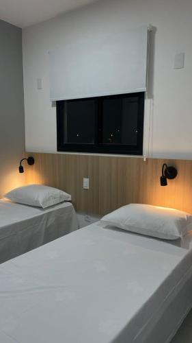 Ένα ή περισσότερα κρεβάτια σε δωμάτιο στο Apartamento Completo com Piscina, Academia e Salão de festas em São Carlos
