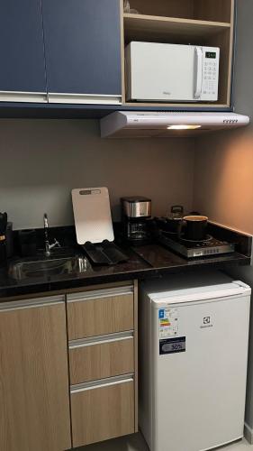 Η κουζίνα ή μικρή κουζίνα στο Apartamento Completo com Piscina, Academia e Salão de festas em São Carlos