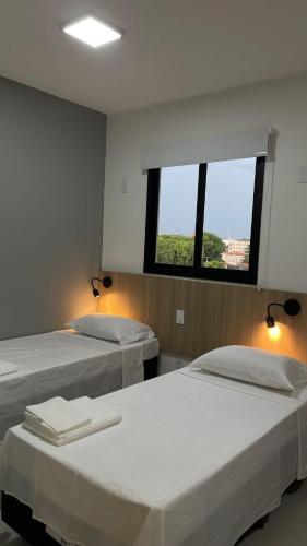 Ένα ή περισσότερα κρεβάτια σε δωμάτιο στο Apartamento Completo com Piscina, Academia e Salão de festas em São Carlos