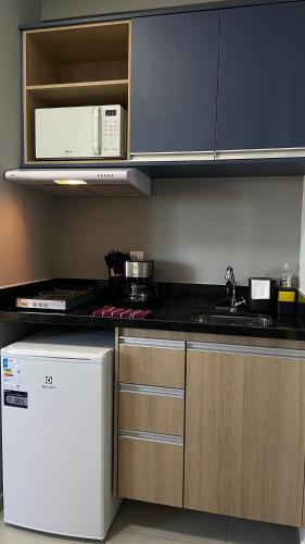 Η κουζίνα ή μικρή κουζίνα στο Apartamento Completo com Piscina, Academia e Salão de festas em São Carlos