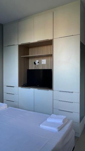 Ένα ή περισσότερα κρεβάτια σε δωμάτιο στο Apartamento Completo com Piscina, Academia e Salão de festas em São Carlos
