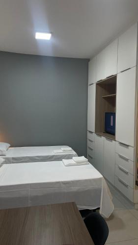 Ένα ή περισσότερα κρεβάτια σε δωμάτιο στο Apartamento Completo com Piscina, Academia e Salão de festas em São Carlos