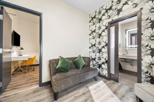 a living room with a couch and a mirror at Hotel EPIK in San Francisco