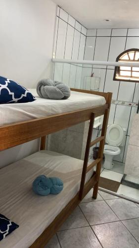 a room with two bunk beds and a toilet at Hostel ABC in Angra dos Reis