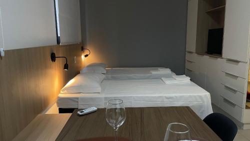 Ένα ή περισσότερα κρεβάτια σε δωμάτιο στο Apartamento Completo com Piscina, Academia e Salão de festas em São Carlos