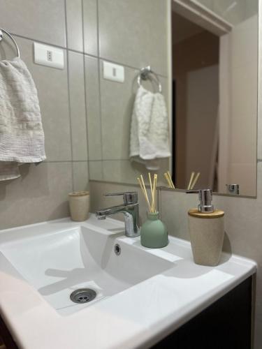 a bathroom with a white sink and a mirror at Casa hacienda in Los Ángeles