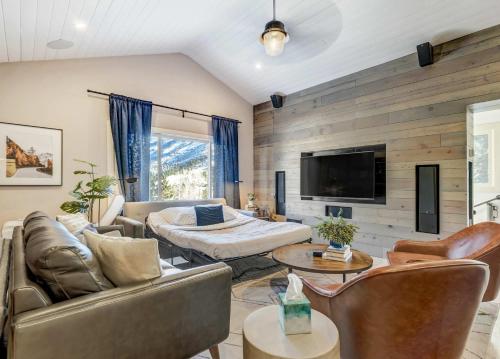 a living room with a couch and a table at Cobalt Peak - Pet-Friendly Sauna Panoramic Views in Cascade-Chipita Park