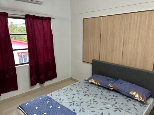 Postel nebo postele na pokoji v ubytování Chengai homestay