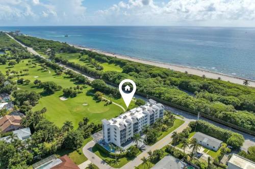 an aerial view of a resort and the ocean at Luxury - 2BR 2BA - Balcony - Right Across From the Beach in Boca Raton