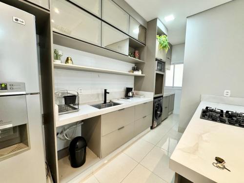 a kitchen with white counters and white cabinets at Sinop Luxury Apartment in Sinop