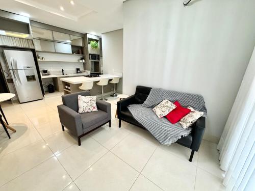 a living room with a couch and a chair at Sinop Luxury Apartment in Sinop
