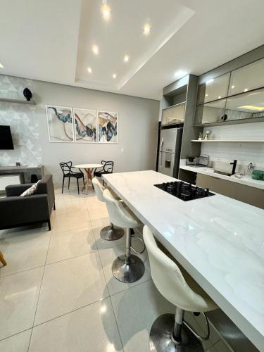 a kitchen and living room with a large table and chairs at Sinop Luxury Apartment in Sinop