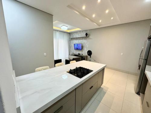 a kitchen with a white counter top in a room at Sinop Luxury Apartment in Sinop