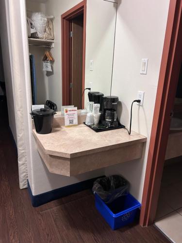 a counter in a room with a coffee maker on it at Super 8 by Wyndham Trois-Rivieres in Trois-Rivières