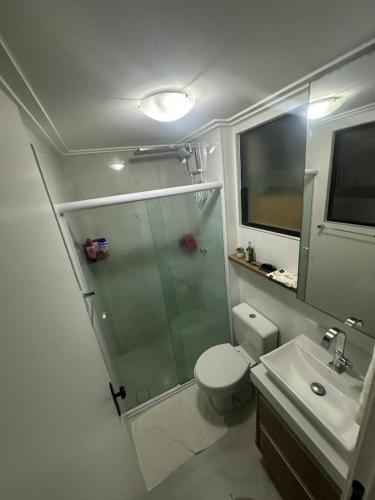 a bathroom with a shower and a toilet and a sink at Apt-igorss-aju in Aracaju