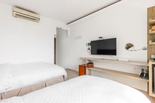 Ein Bett oder Betten in einem Zimmer der Unterkunft Fairyland & Farm Guest House