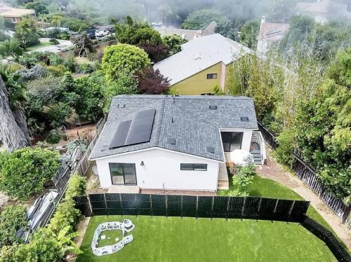 an aerial view of a house with a solar roof at The Quaint Cardiff Hideaway with Pak N Play in Encinitas