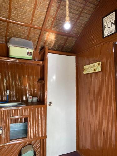 a room with a white door and a sign at Eco Park - Albur Rental Properties in Alburquerque