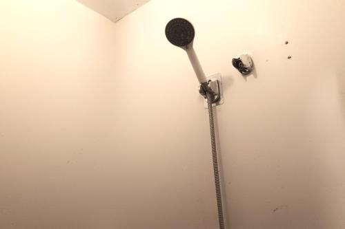 a toothbrush is hanging on a wall at Hotel Villarte in San Fernando