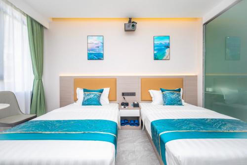 Postel nebo postele na pokoji v ubytování Zhuhai Xiangzhou Yijing Express Hotel
