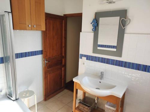 a bathroom with a sink and a mirror at Charmante maison en pierre avec piscine privée, 8 personnes, proche des Bastides - FR-1-824-19 in Le Buisson de Cadouin