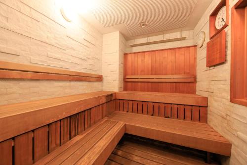 a sauna with wooden benches in a room at Hakone Hisui in Hakone