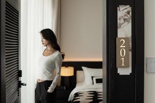 Ένα ή περισσότερα κρεβάτια σε δωμάτιο στο Dali Li Hotel