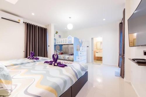 Postel nebo postele na pokoji v ubytování Mind Pool Villa บ้านพักพูลวิลล่าชะอำ