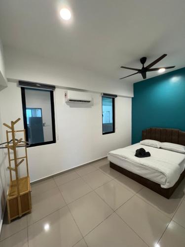 a bedroom with a bed and a ceiling fan at Lavender Villa Marc Residence Bukit Mertajam in Bukit Mertajam