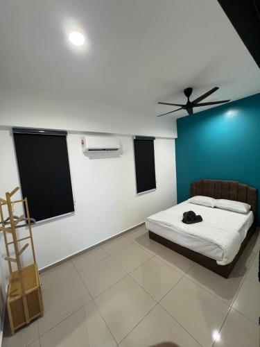 a bedroom with a bed and a ceiling fan at Lavender Villa Marc Residence Bukit Mertajam in Bukit Mertajam