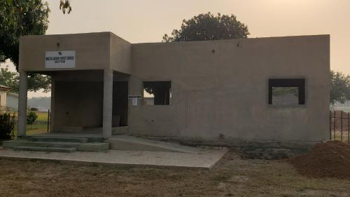 a building under construction with a sign on it at Volta Safari Guest House in Atimpoko