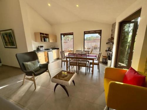 a living room with a couch and a table at Loft Kaela en, Val'Quirico in Santeagueda