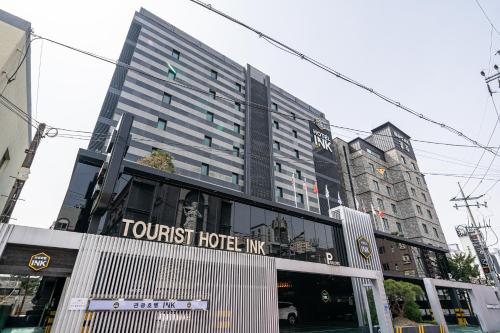 a building with the words tourist hotel mg at Gong-Ju TouristHotel INK in Gongju
