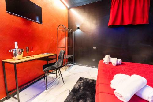 TV a/nebo společenská místnost v ubytování Il corso suite rooms
