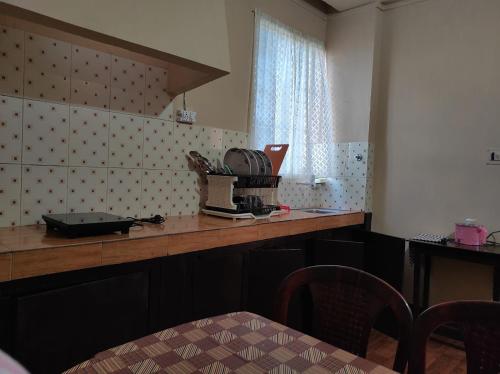 Η κουζίνα ή μικρή κουζίνα στο ArJe's Homestay