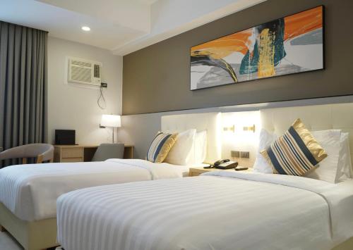 Postel nebo postele na pokoji v ubytování Amarah Hotel