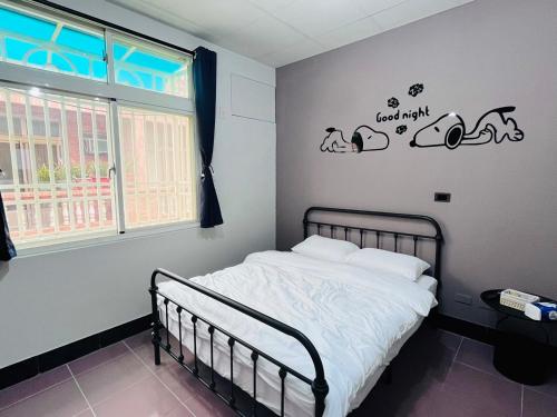 Postel nebo postele na pokoji v ubytování Kinmen Otter Wave Homestay