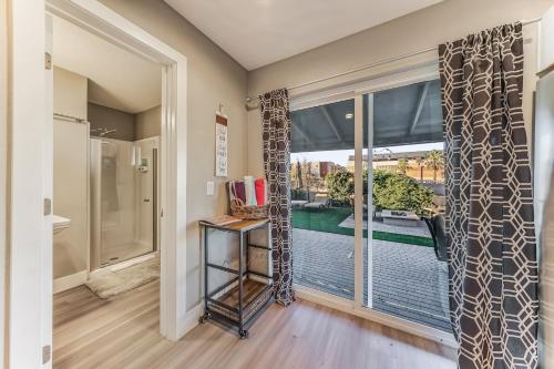 a room with a large window with a view of a pool at Tempe Joy House With Backyard Sanctuary By Asu in Tempe