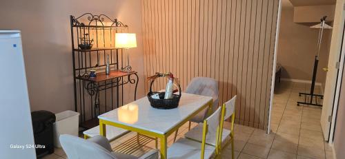 a dining room table with a vase on it at 70 percent Off Luxurious Hot Tub,Sauna, 2000Sqft of Private in Vaughan