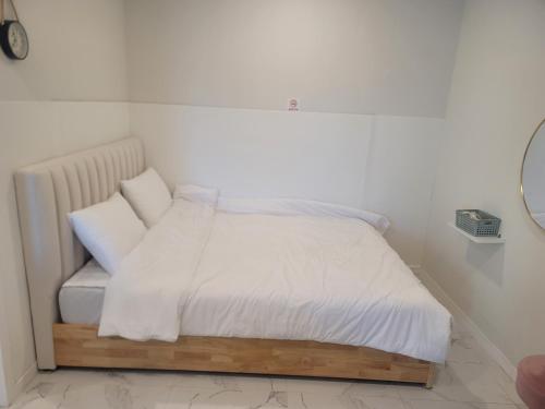 Gangneung Libertte Pensionにあるベッド